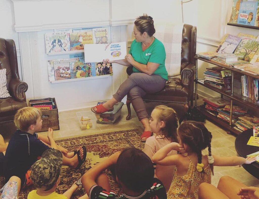 Woman reading to kids